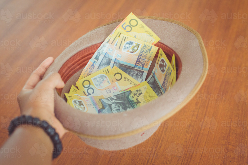 Aussie tradie collecting money in his hat as he didn't put payment terms on a job invoice