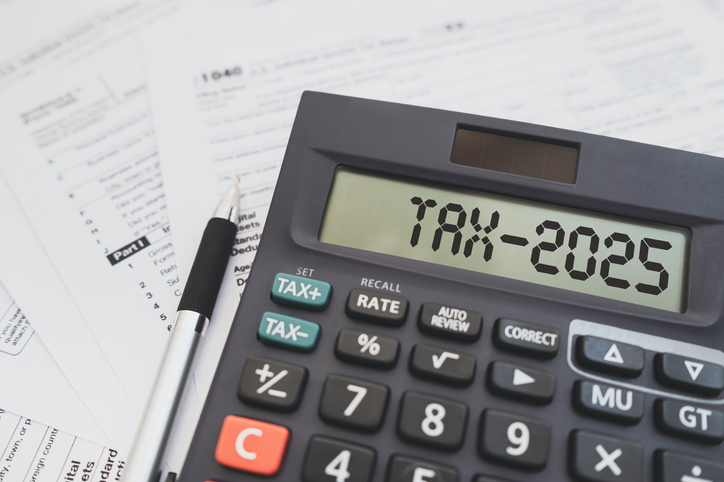 Tradie working on tax and compliance documents, highlighting important deadlines for superannuation, payroll finalisation, BAS, and TPAR.