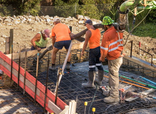 Subcontractors working on site at concreting job