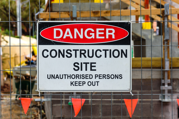 Melbourne builder reviewing site plans alongside bookkeeping records to track project costs